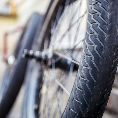 close-up-bmx-bicycle-parts-outdoors-on-the-ground-tires-wheels-and-rudder.jpg